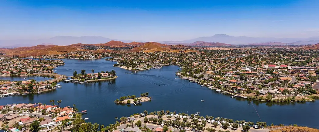 Aerial view of Canyon Lake, California, showing homes surrounding the private lake in Riverside County