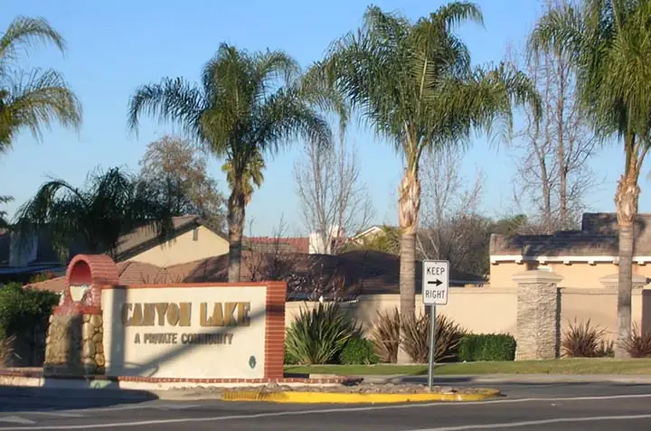 The Canyon Lake main gate entrance monument sign reading A Private Community, Riverside County, California