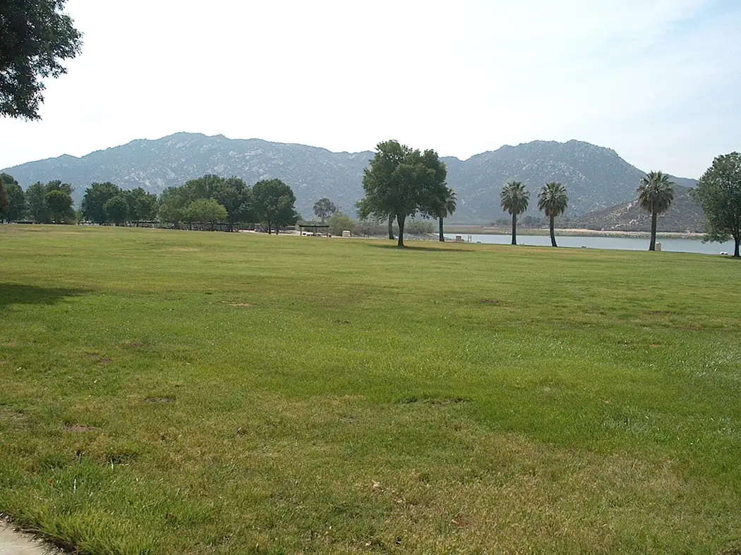 Lawns, palm trees and the shoreline at Lake Perris State Recreation Area in Riverside County, California